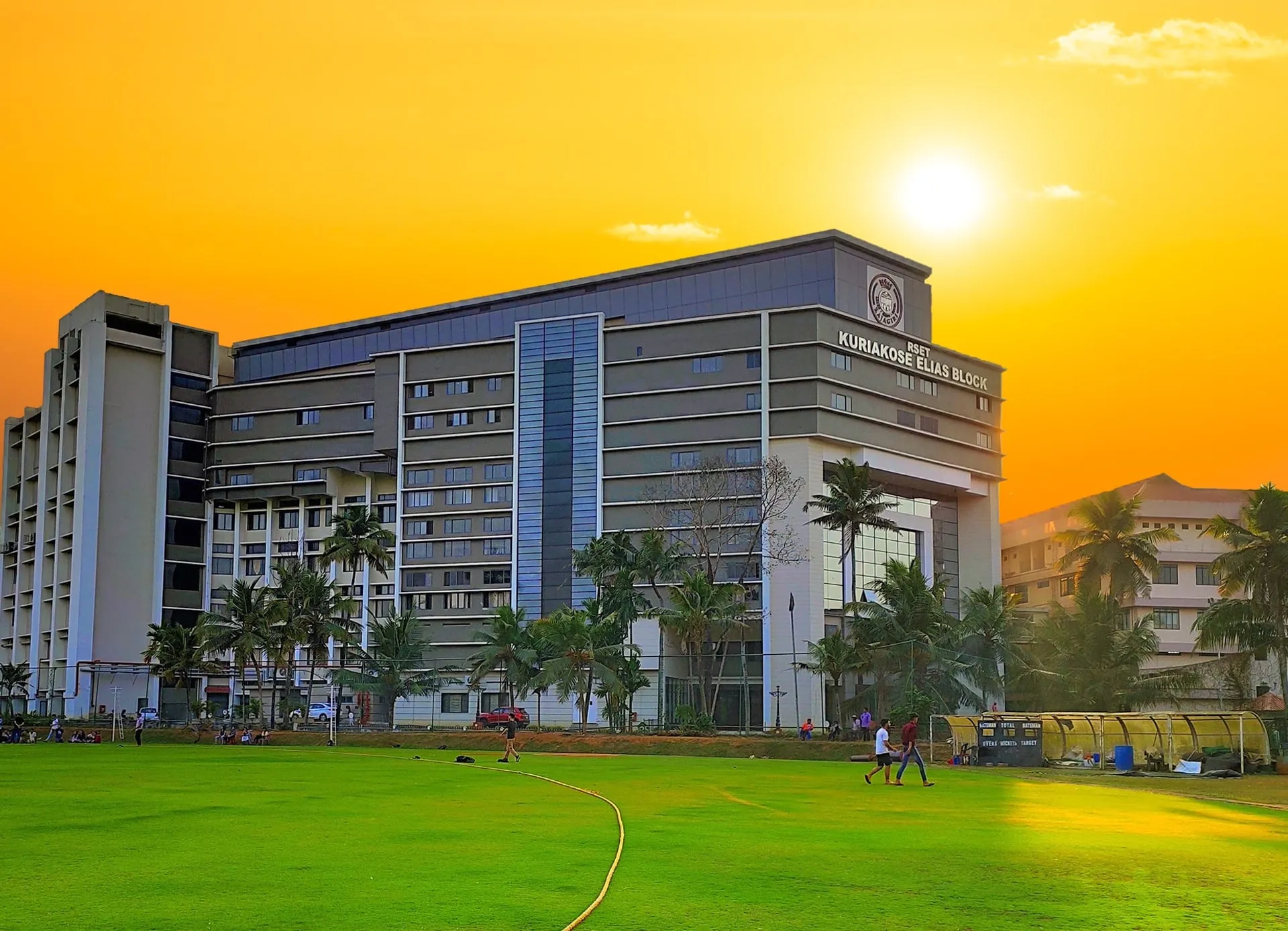 Kuriakose Elias Block at sunset beside the RSET playing field